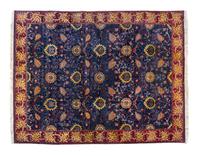 An Indian Wool Rug 13 feet 10 inches x 10 feet 10 inches. — FIRST HALF 20TH CENTURY