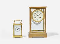 Two French gilt bronze carriage clocks, one by Samuel Marti & Cie, retailed by Tiffany & Co., New York, NY, the other imported by Harris & Harrington (1896-1919), New York, circa 1900