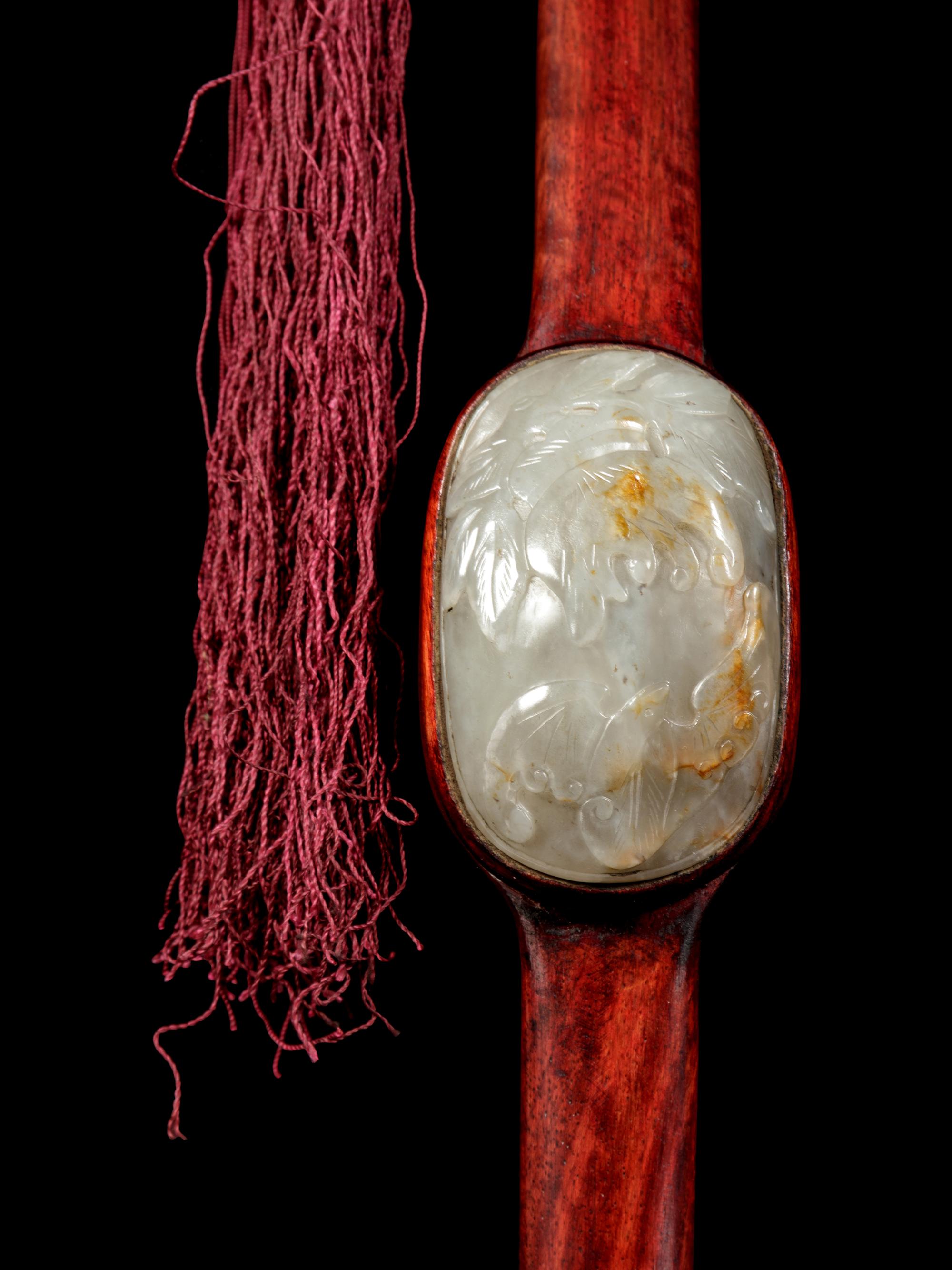 A Chinese Russet and Celadon Jade Inset Hardwood Ruyi Scepter