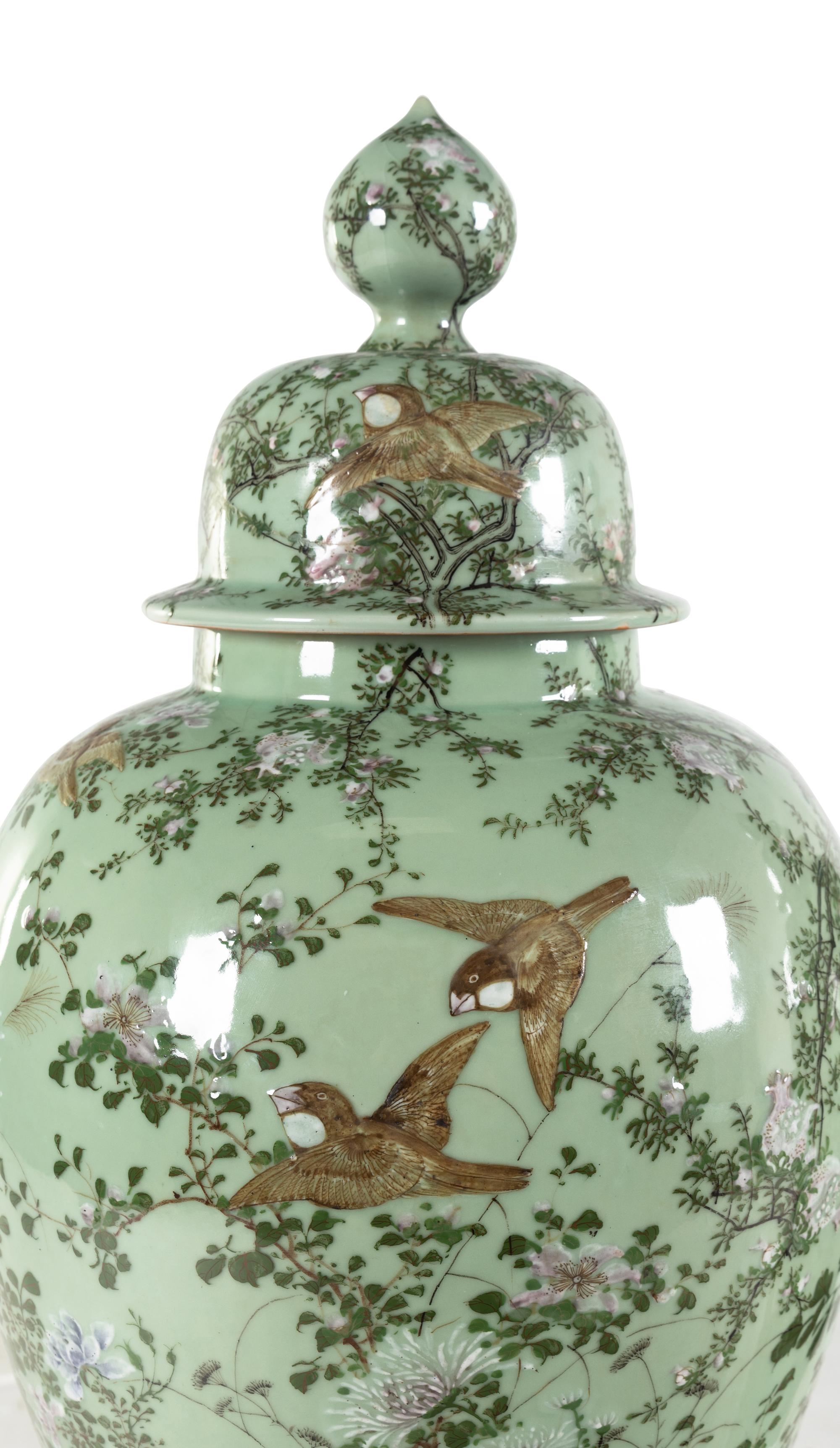 A Pair of Chinese Large Porcelain Covered Urns on Pedestals