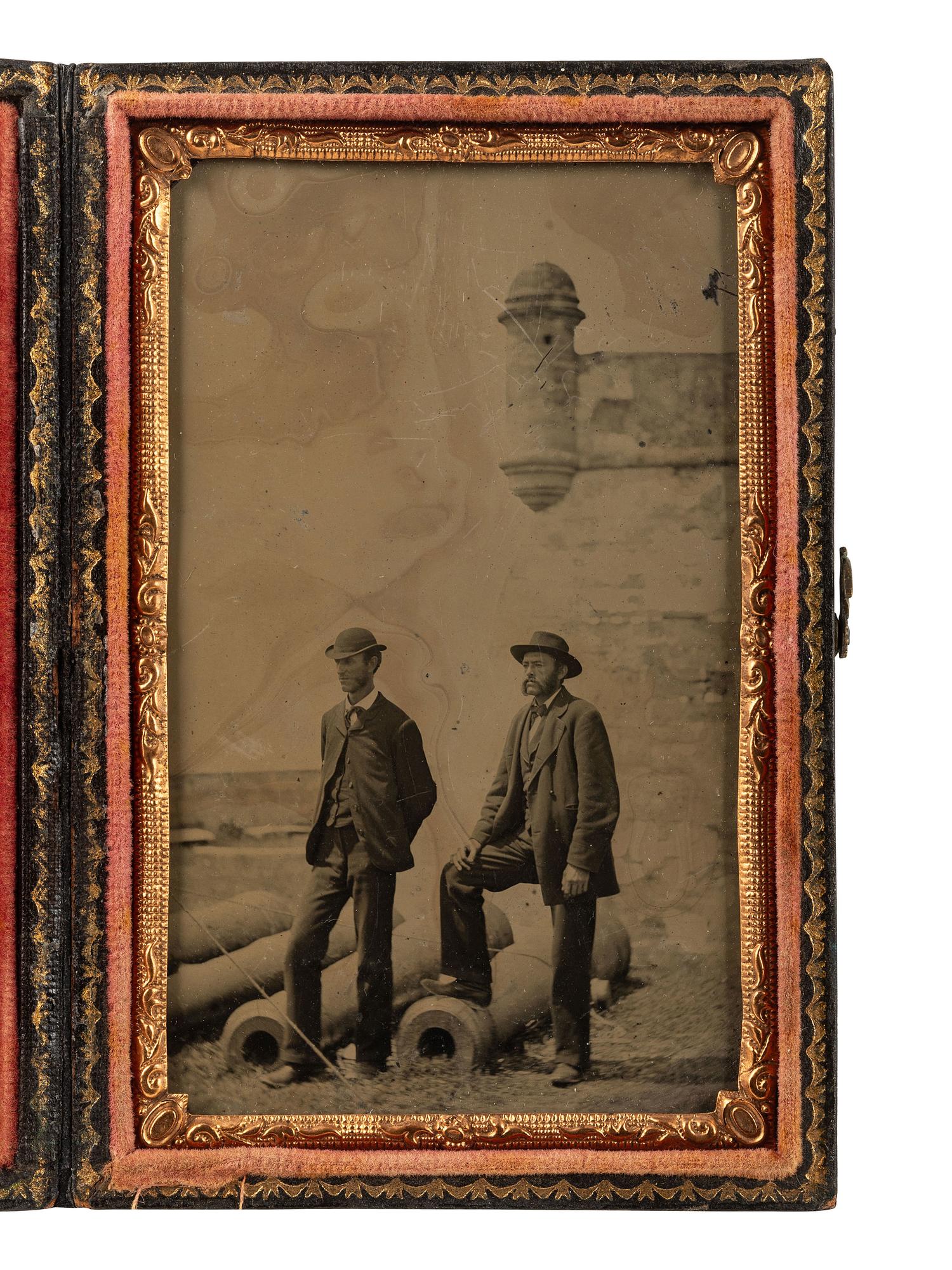 [CIVIL WAR]. CDV-size tintype of two civilians standing before Fort Marion in St. Augustine, FL.