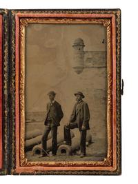 [CIVIL WAR]. CDV-size tintype of two civilians standing before Fort Marion in St. Augustine, FL.