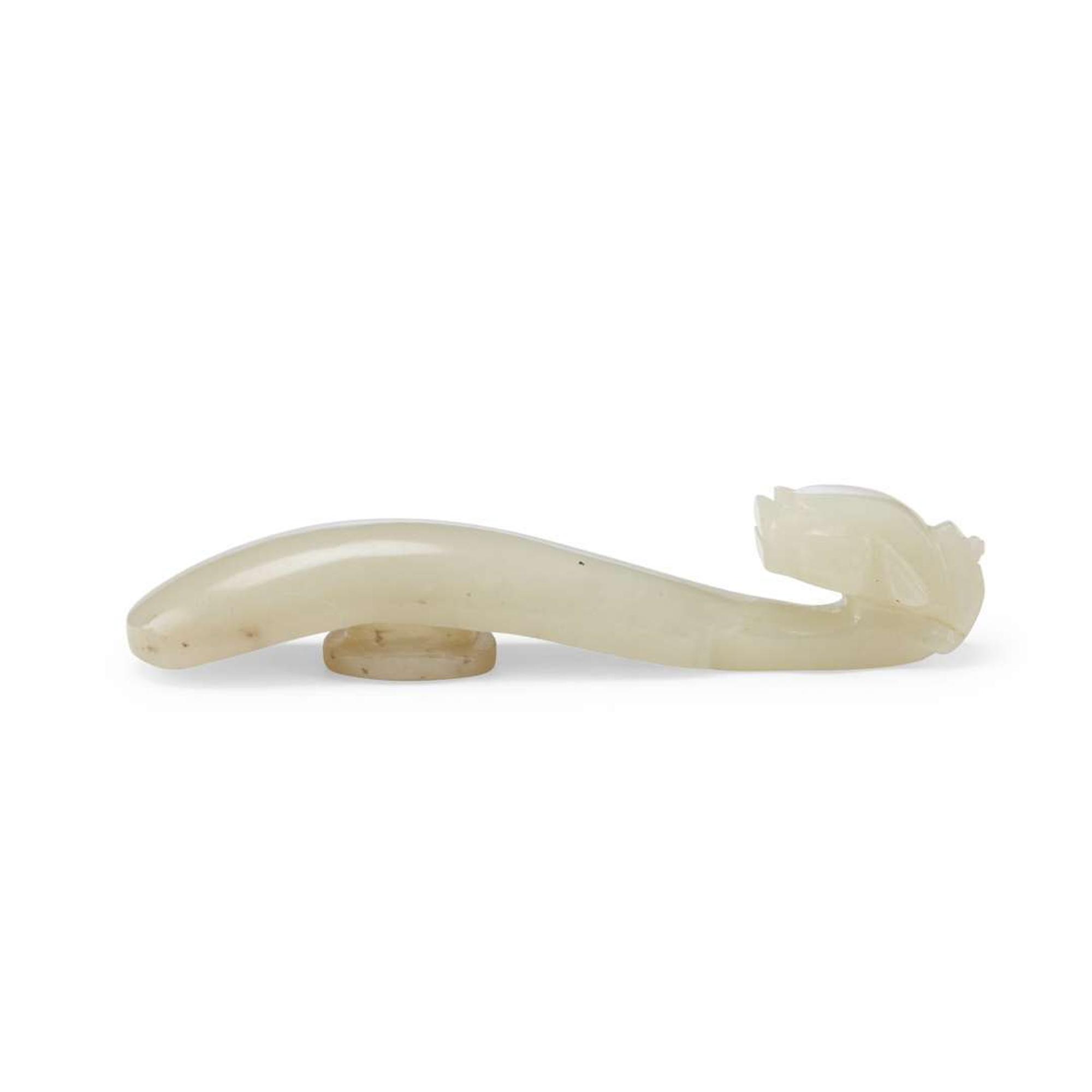 Four Chinese Greyish White Jade "Dragon" Head Belt Hooks, Qing Dynasty — 清 灰白玉龍鉤四件