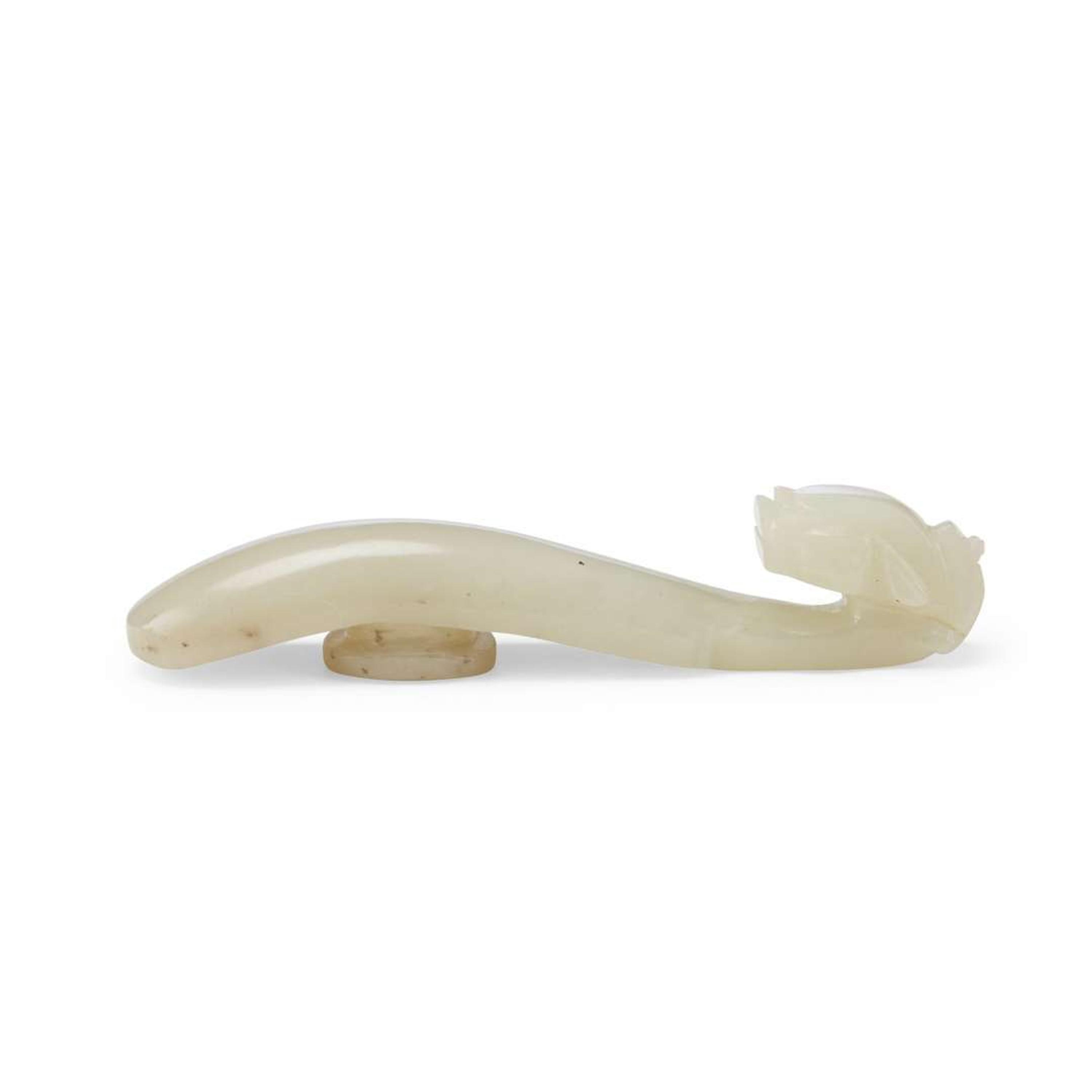 Four Chinese Greyish White Jade "Dragon" Head Belt Hooks, Qing Dynasty — 清 灰白玉龍鉤四件
