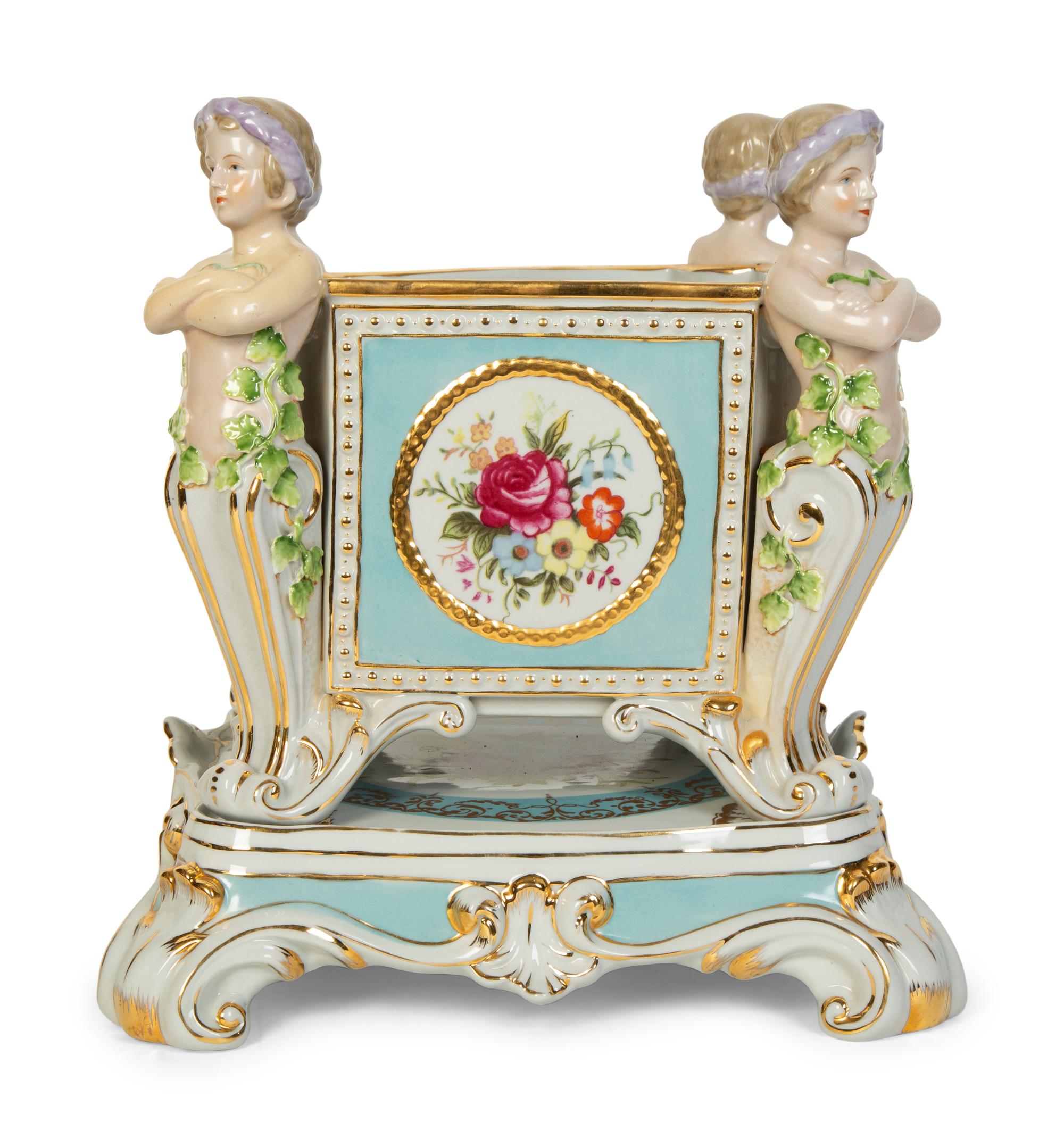 A Continental Porcelain Jardinière and Stand