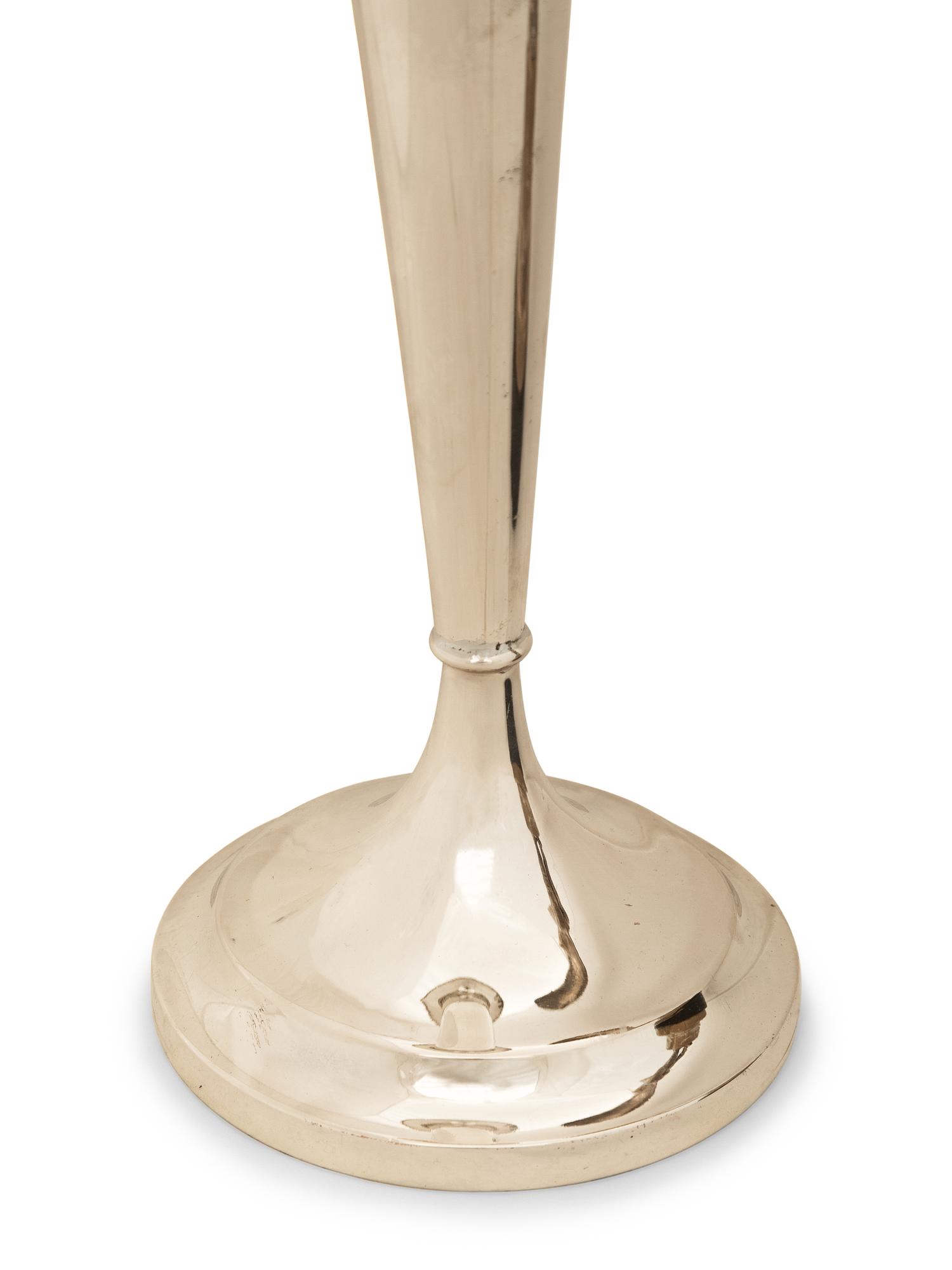 An American Silver Trumpet Vase and A Silvered-Metal Figure of a Winged Dancer