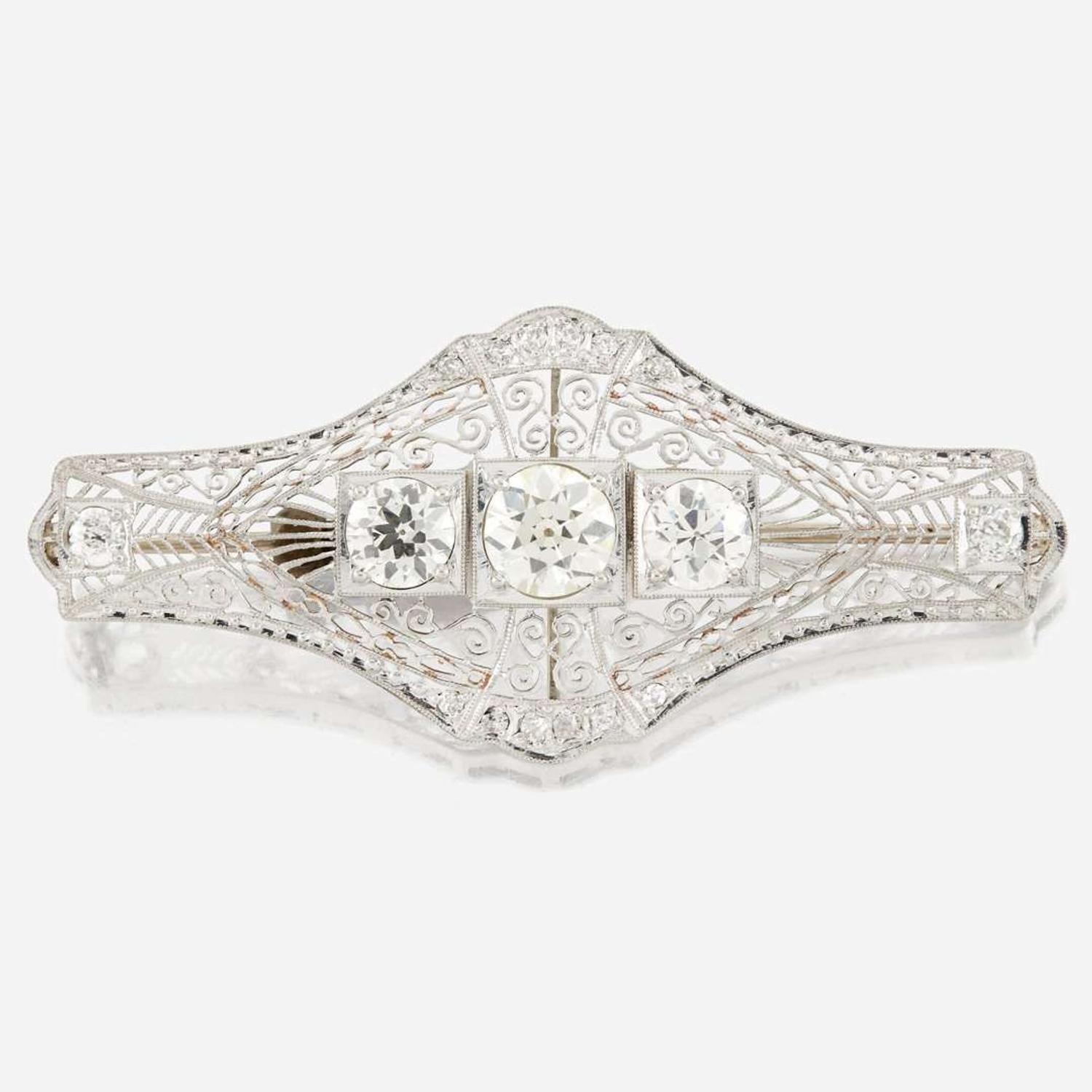 A diamond and white gold brooch