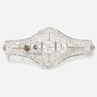 A diamond and white gold brooch