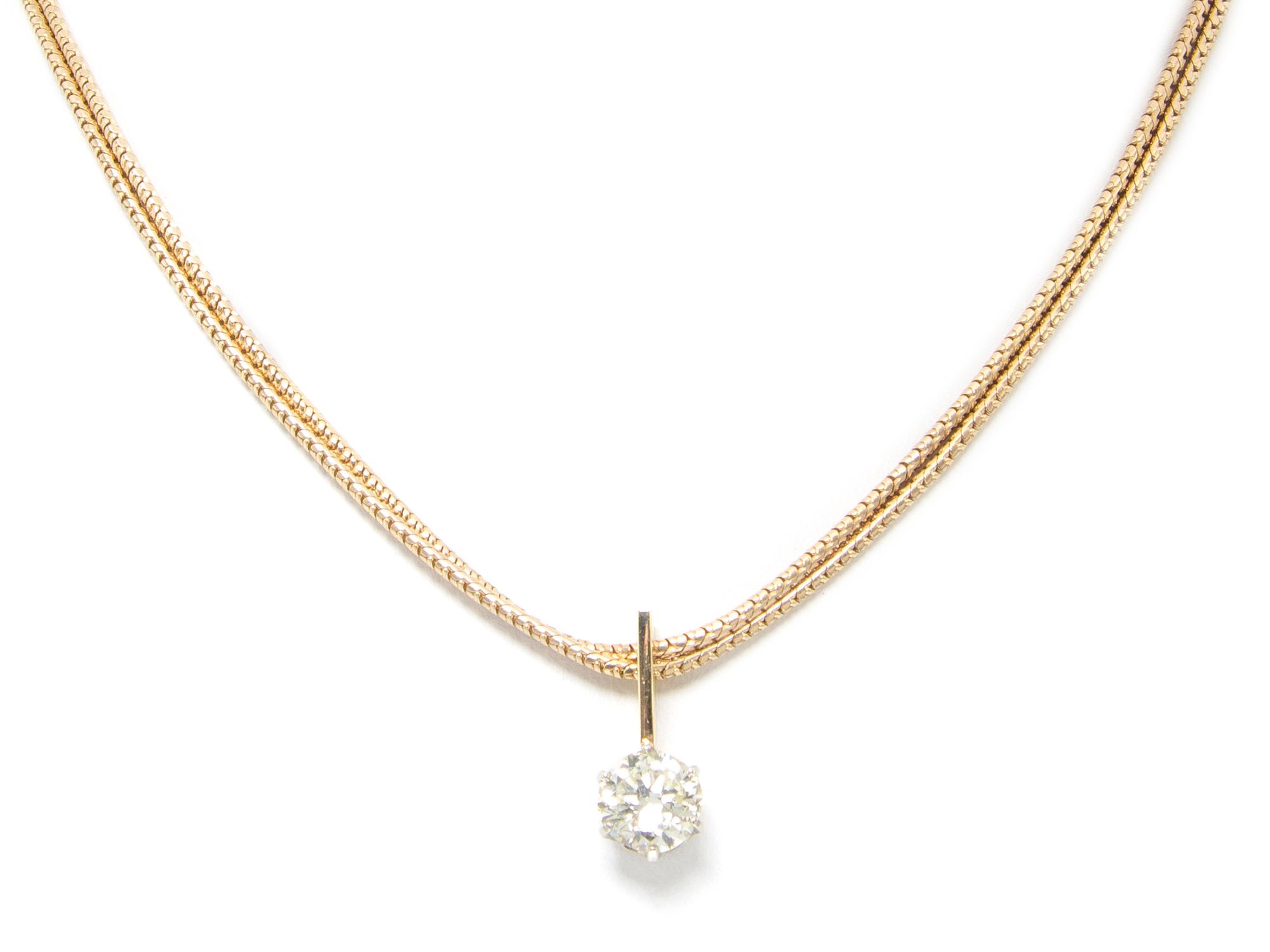 A 14 Karat Yellow Gold and Diamond Solitaire Necklace, 12.50 dwts.