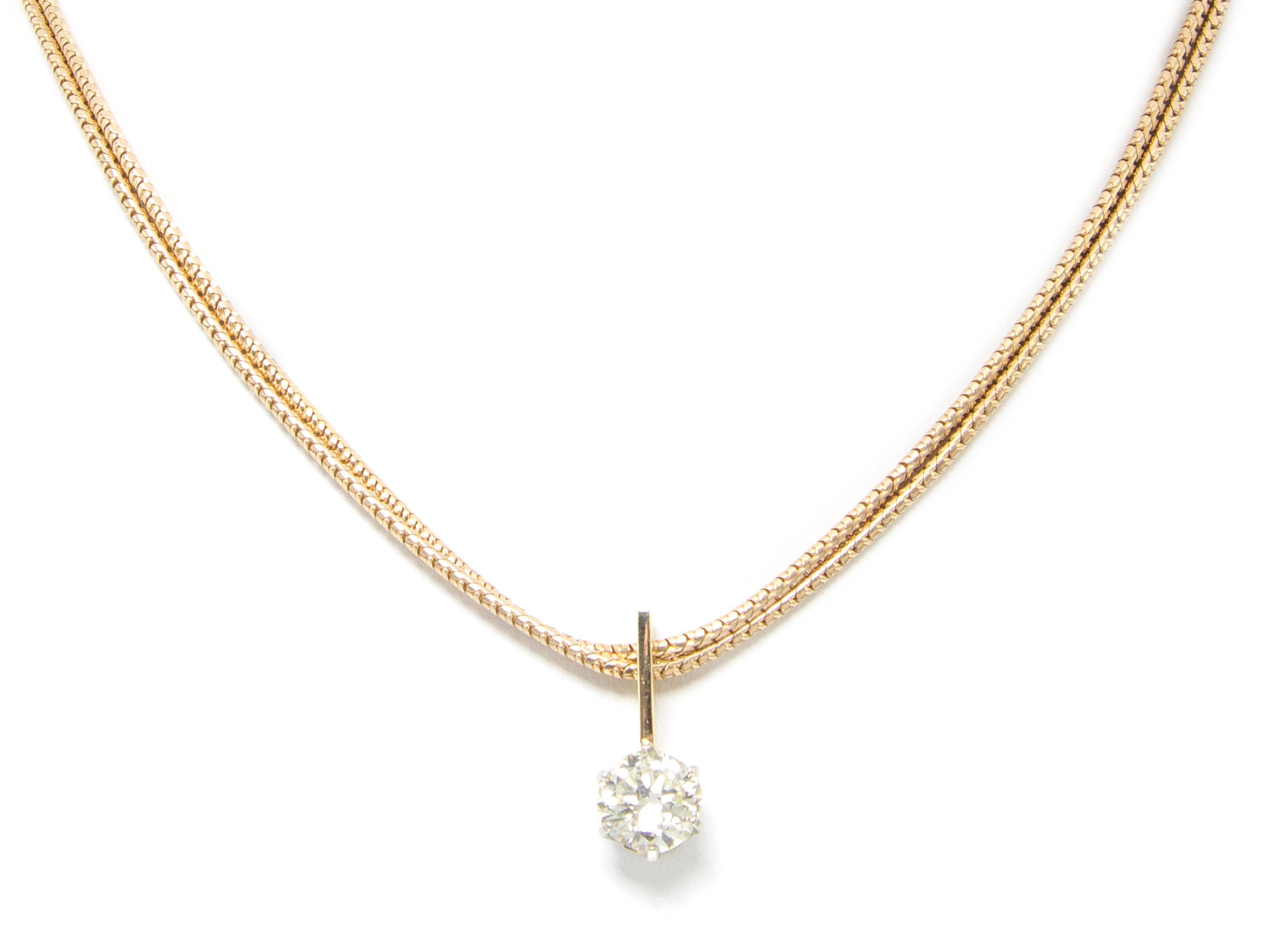 A 14 Karat Yellow Gold and Diamond Solitaire Necklace, 12.50 dwts.