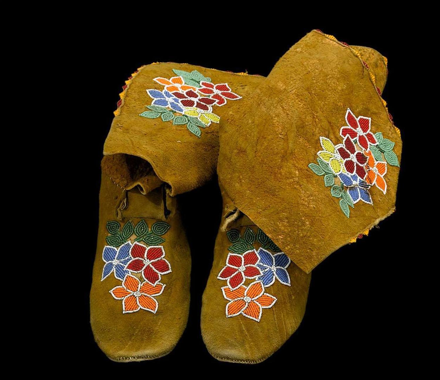 Pair of Prairie women's hide beaded moccasins first half 20th century