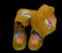 Pair of Prairie women's hide beaded moccasins first half 20th century