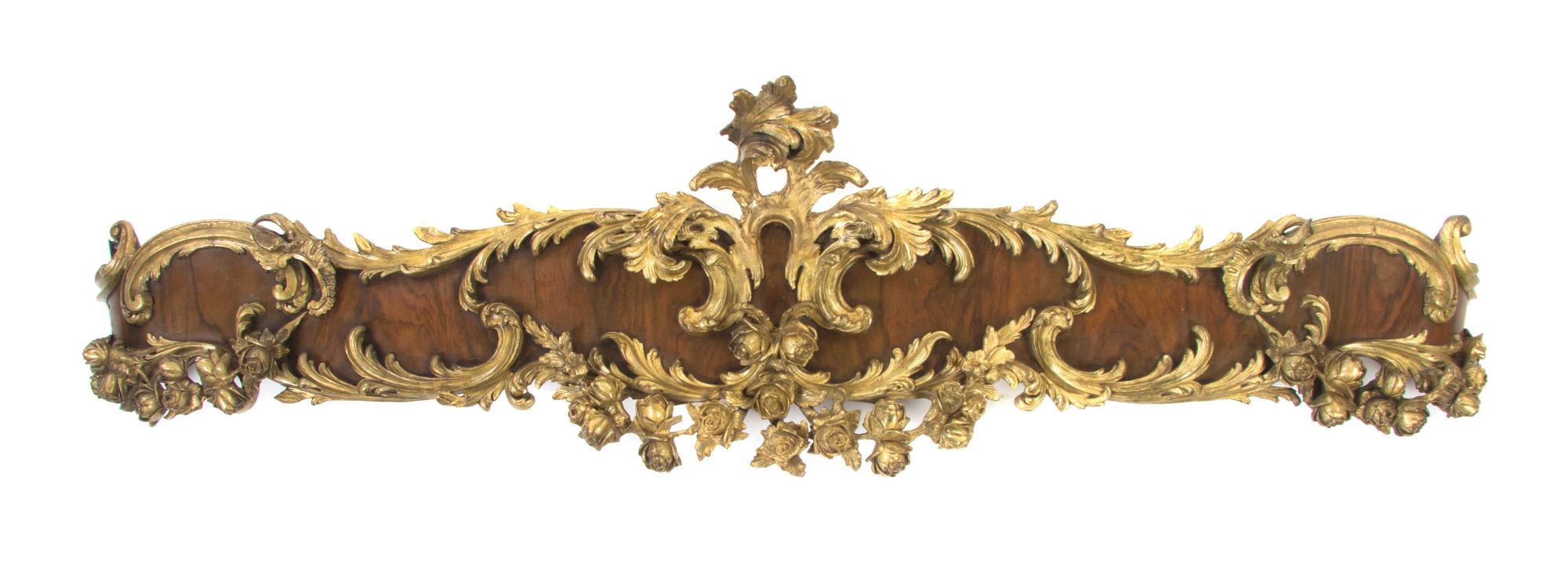 A Pair of Louis XV Style Parcel Gilt Mahogany Valances, Width 62 inches.