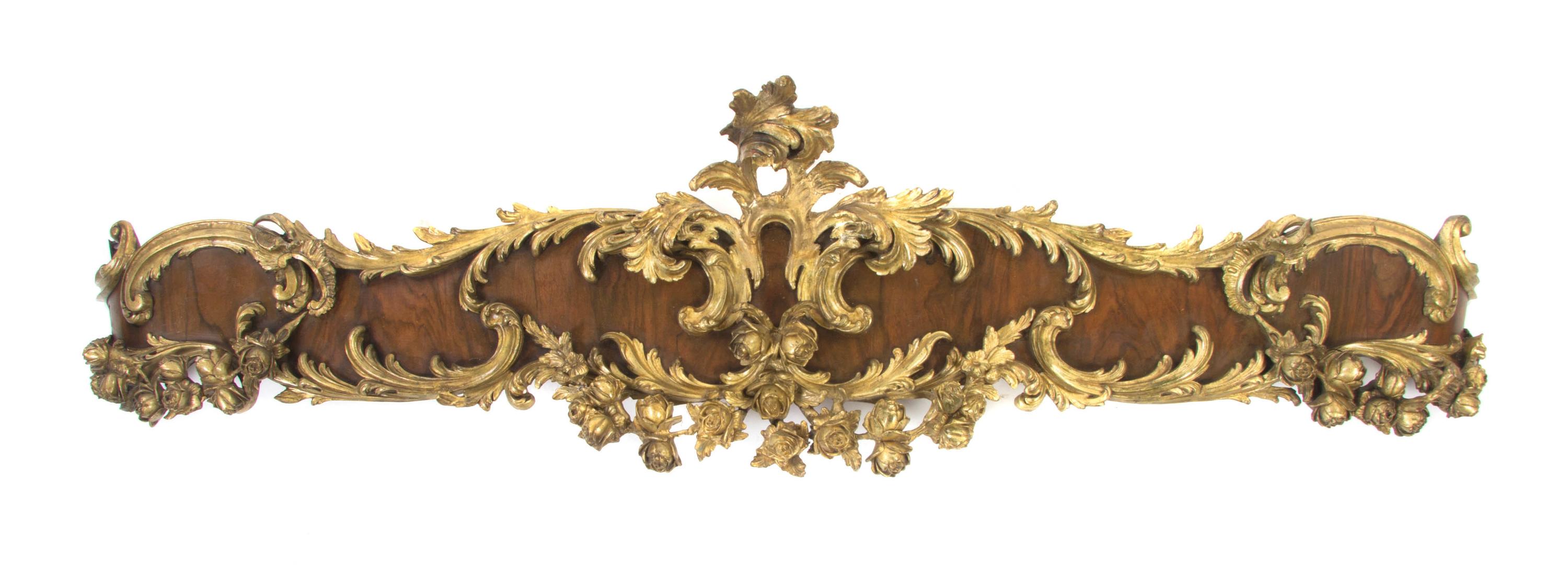 A Pair of Louis XV Style Parcel Gilt Mahogany Valances, Width 62 inches.