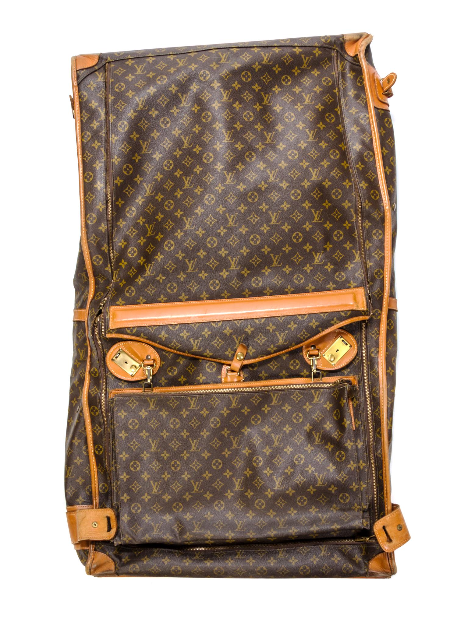 A Louis Vuitton Monogram Canvas Soft-sided Suitcase and Folding Garment Bag, 29 1/2 x 20 x 9 inches.