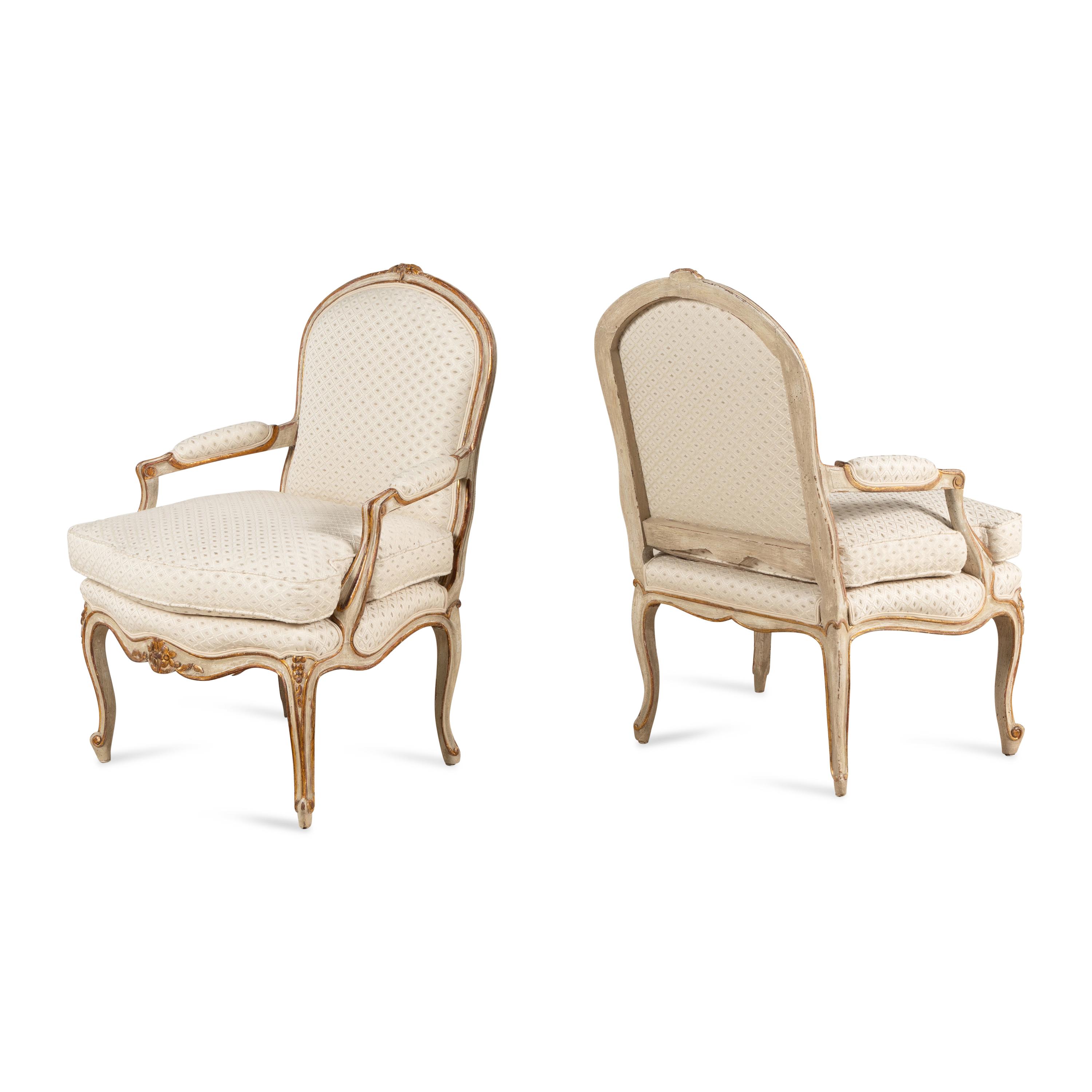 A Pair of Louis XV Style Painted and Parcel Gilt Fauteuils