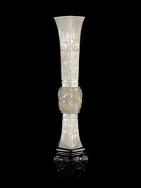 A Carved White Jade Gu Vase
