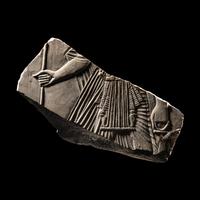 An Egyptian Limestone Relief Fragment with a Pharaoh