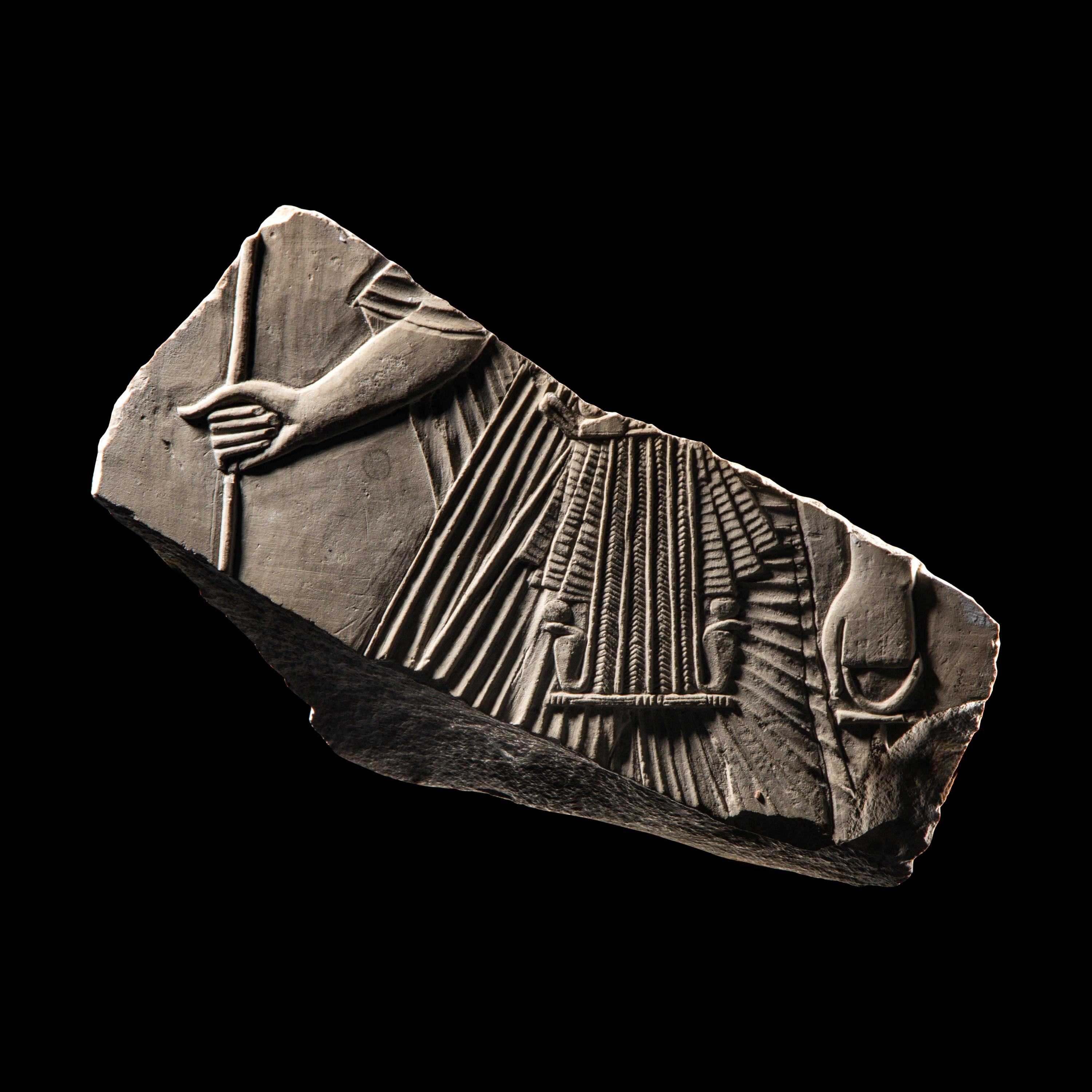 An Egyptian Limestone Relief Fragment with a Pharaoh