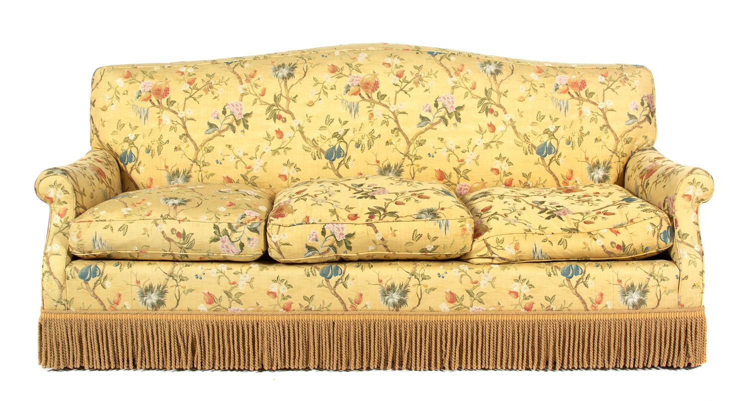 An Upholstered Three-Cushion Sofa Height 34 1/2 x width 82 inches. — 20TH CENTURY
