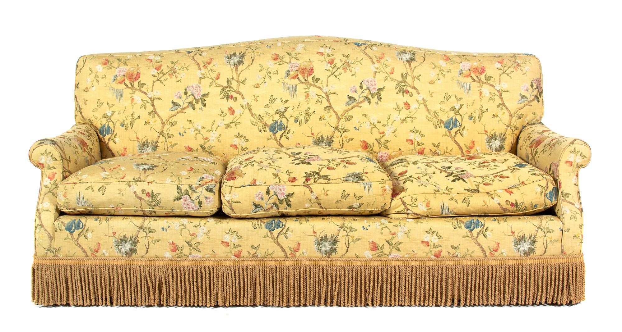 An Upholstered Three-Cushion Sofa Height 34 1/2 x width 82 inches. — 20TH CENTURY