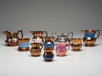Twenty Lusterware Pitchers and Creamers