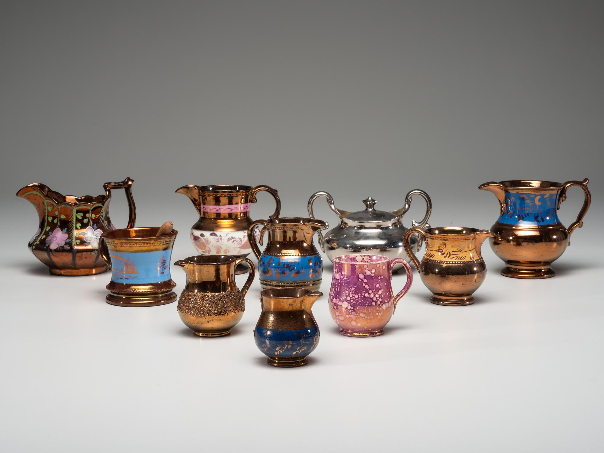Twenty Lusterware Pitchers and Creamers