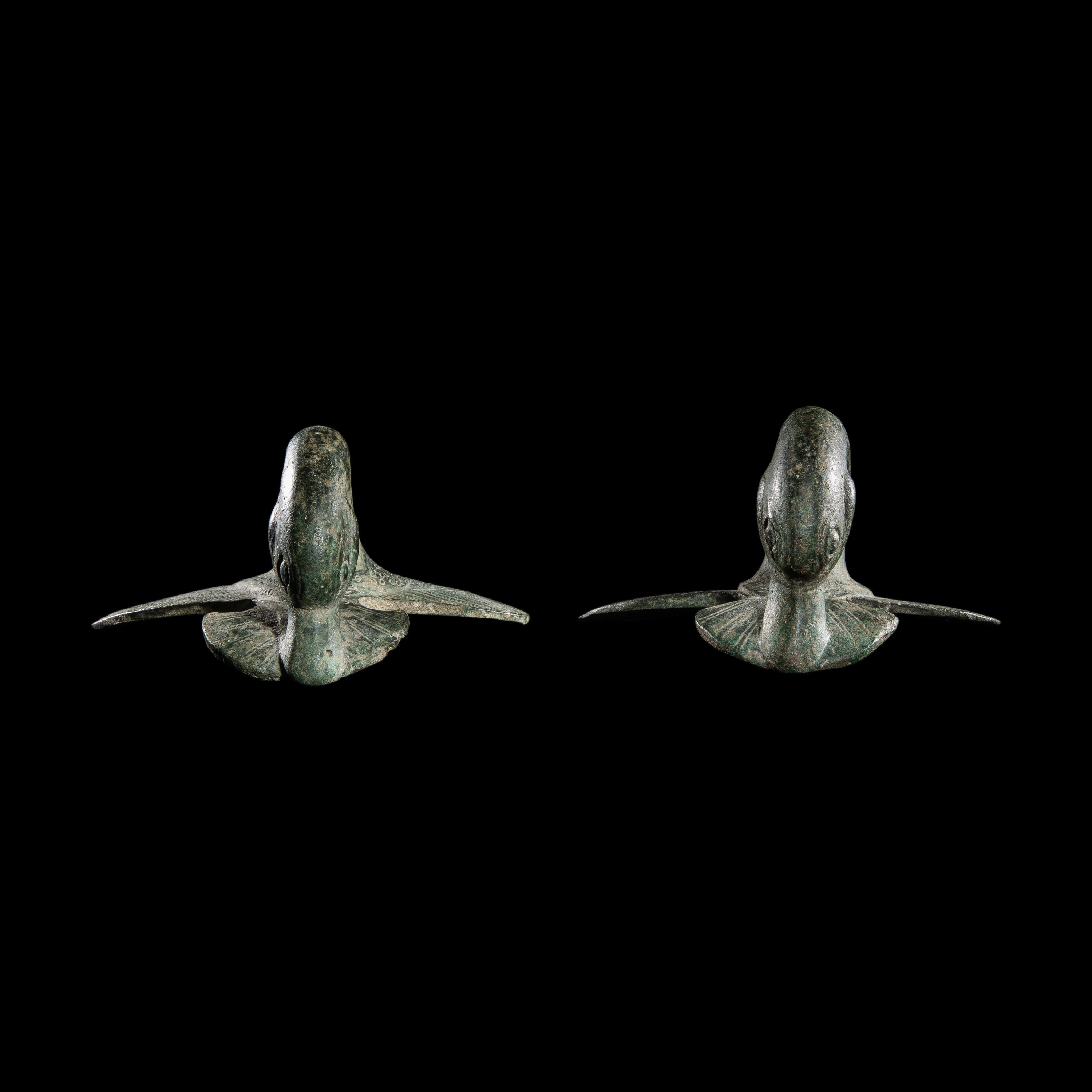 A Pair of Etruscan Bronze Vessel Handles