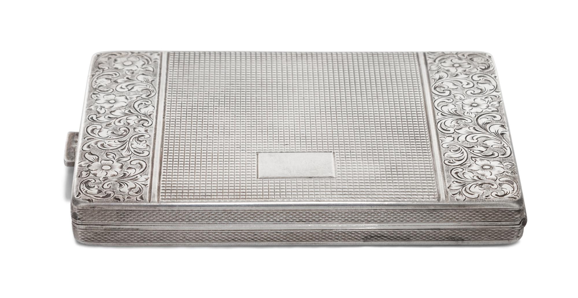A Silver-Plate Cigarette Case, 20th Century, of rectangular hinged form with foliate and textured external decoration and gilt interior