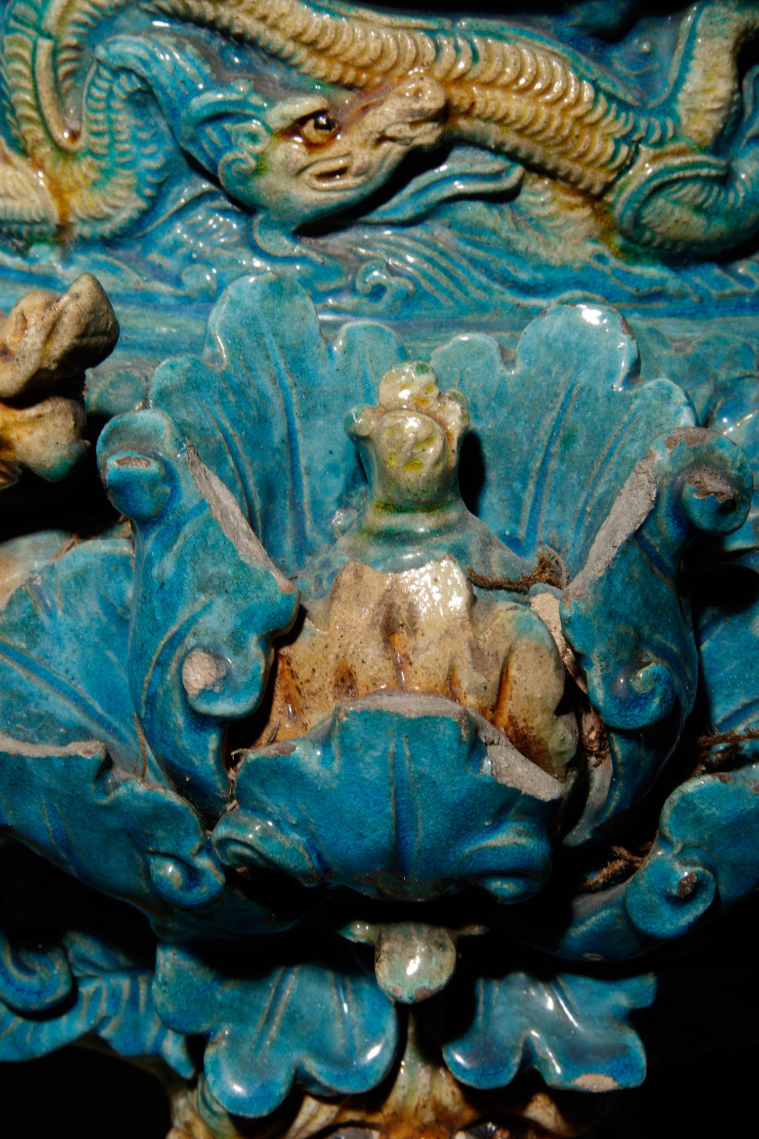 A Turquoise and Ochre Glazed Tileworks Tripod Incense Burner