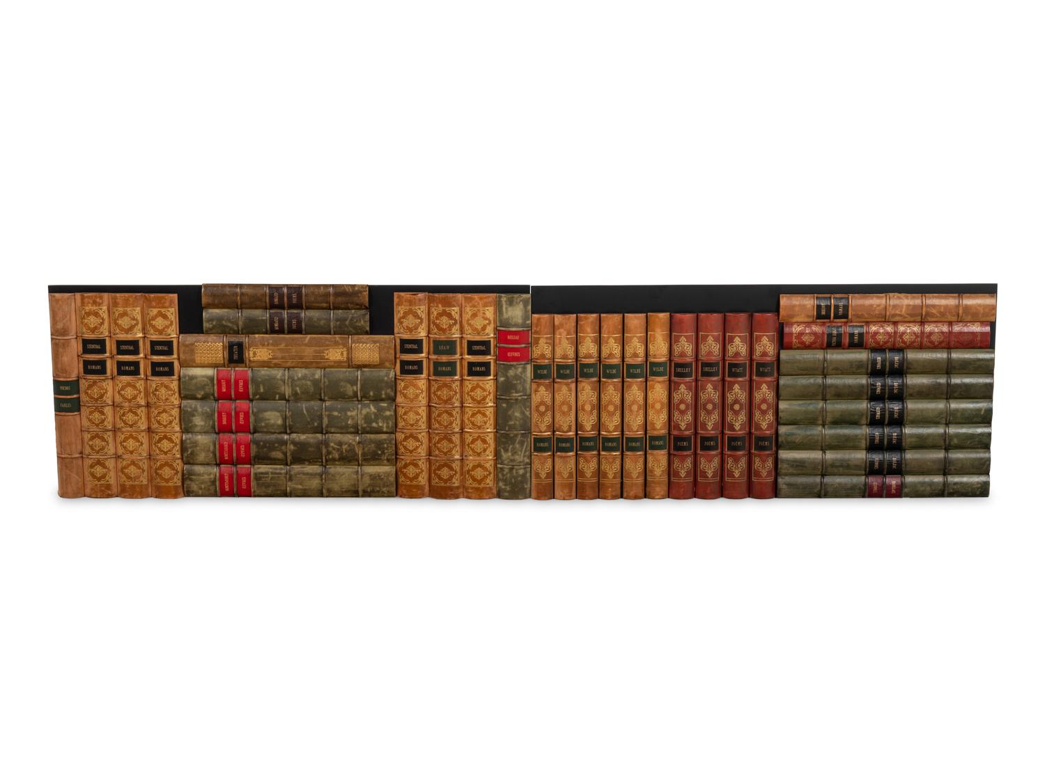 Twenty-Six Custom Gilt-Tooled and Leather-Accented Shelf Plaques Simulating Books