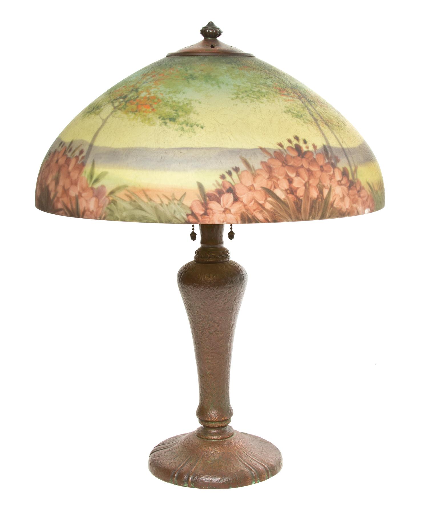 A Handel Reverse Painted Glass Table Lamp, Height overall 23 1/2 inches x diameter of shade 17 3/4 inches.