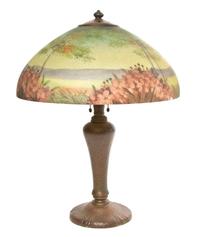 A Handel Reverse Painted Glass Table Lamp, Height overall 23 1/2 inches x diameter of shade 17 3/4 inches.