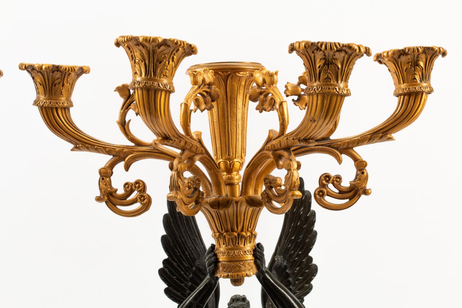 A Pair of Empire Style Gilt and Patinated Bronze Five-Light Candelabra