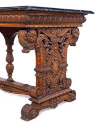 A Karpen Renaissance Revival Carved Oak Marble-Top Table