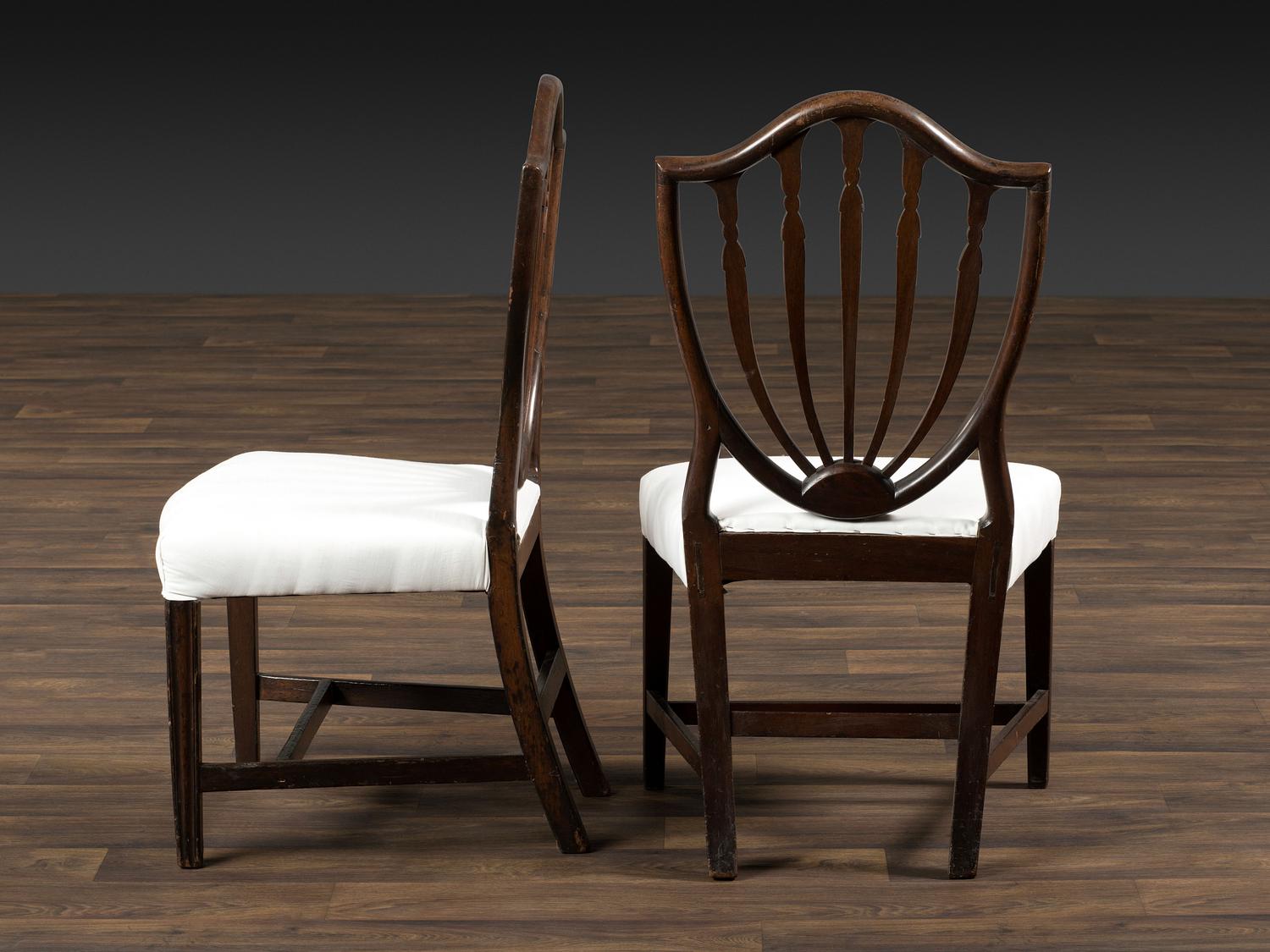 A Set of Eight Federal Carved Mahogany Shield-Back Dining Chairs