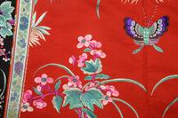 A Red Ground Embroidered Silk Manchu Lady's Robe