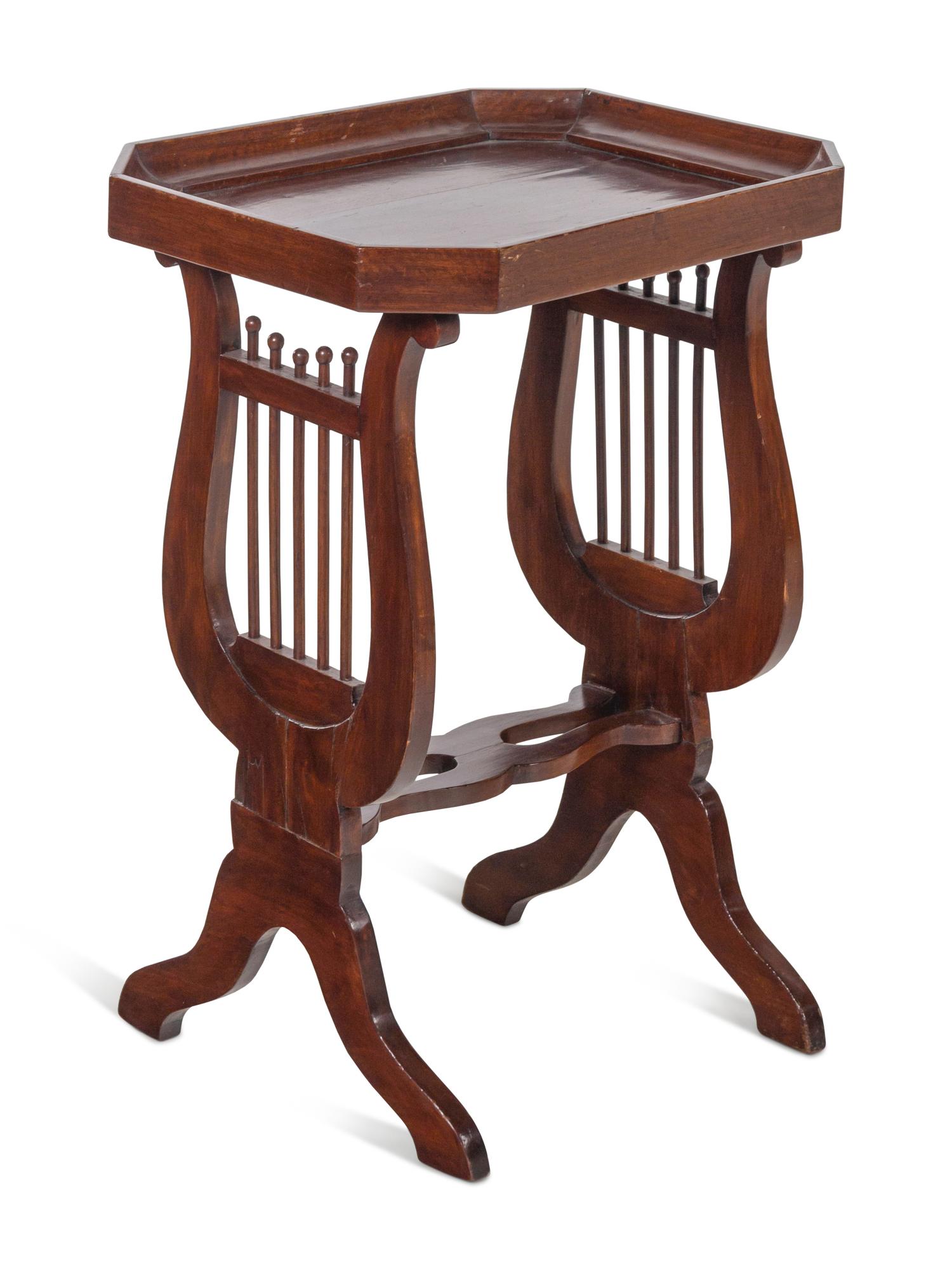 A Continental Mahogany Side Table with Lyriform Supports