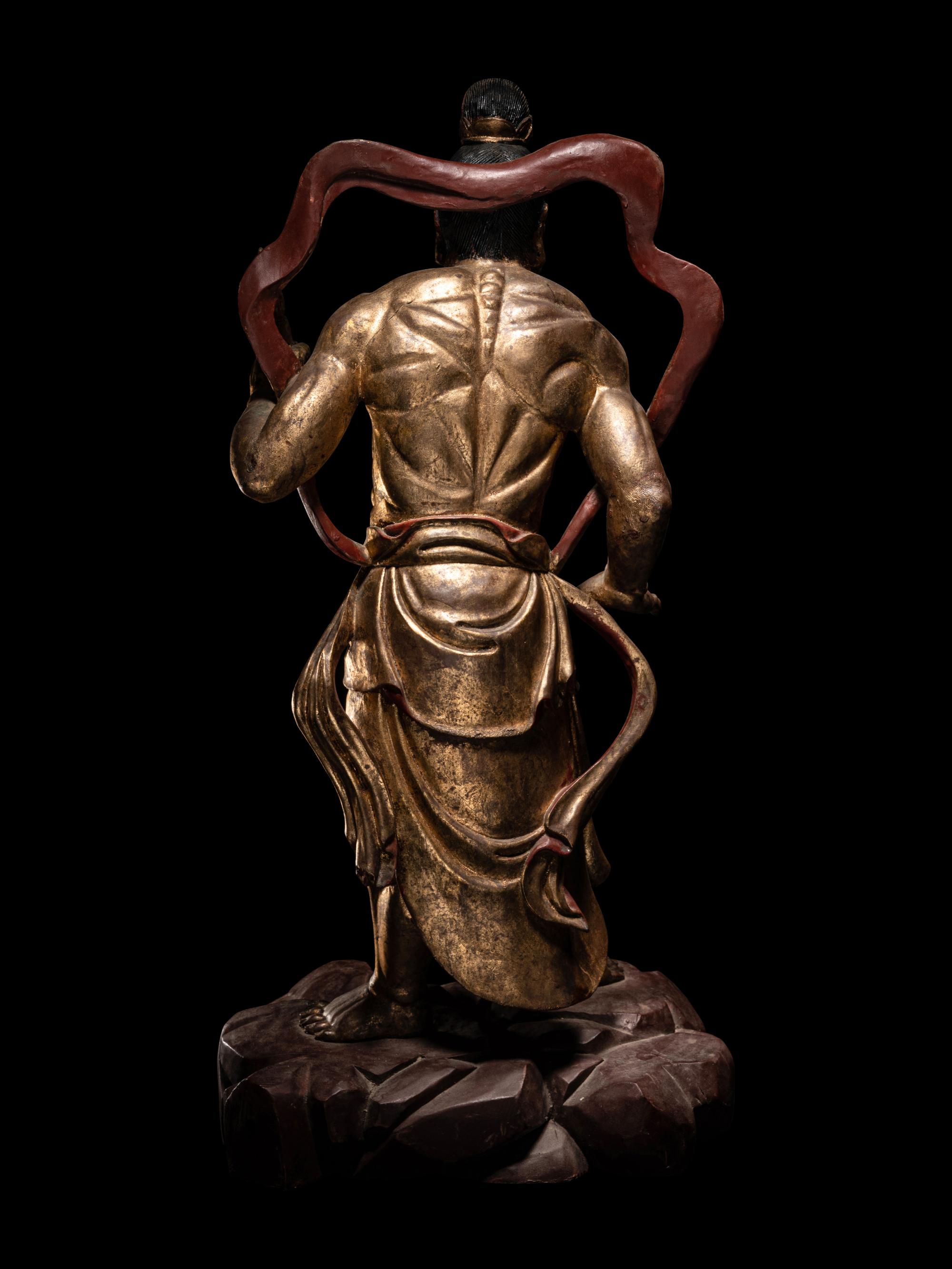 A Pair of Chinese Gilt and Red Lacquered Wood Figures of Wrathful Guardians