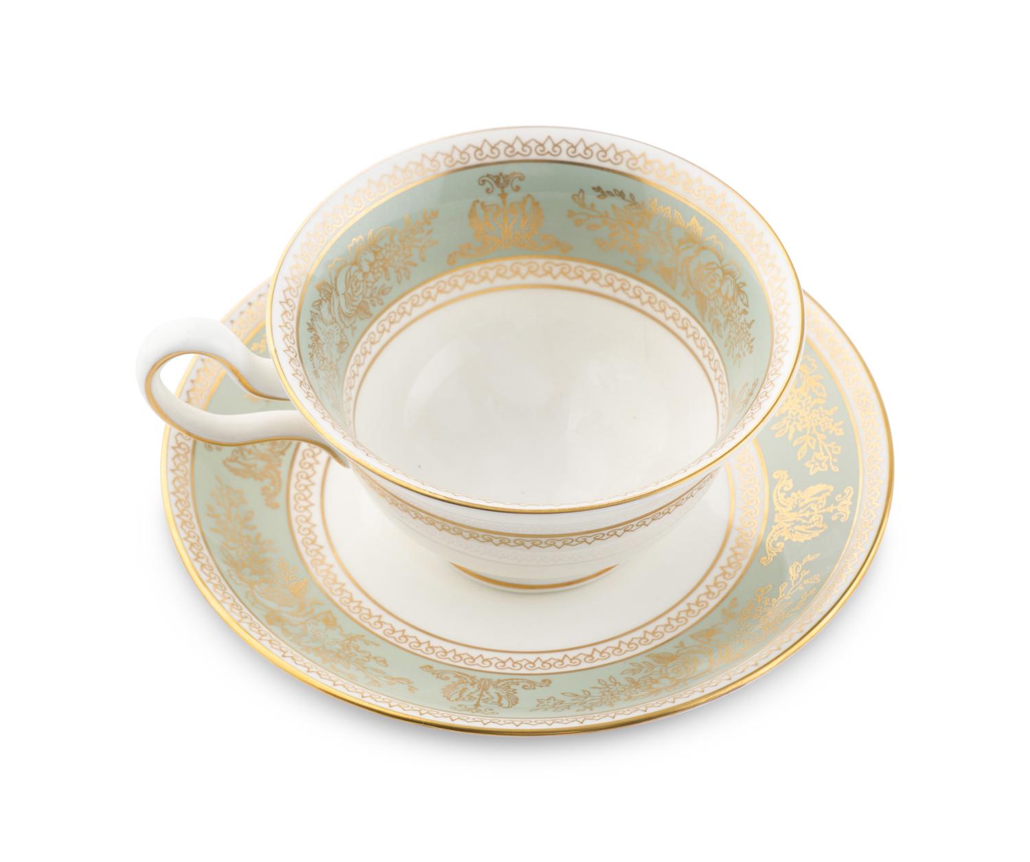 A Wedgwood Gold Columbia Porcelain Dinner Service