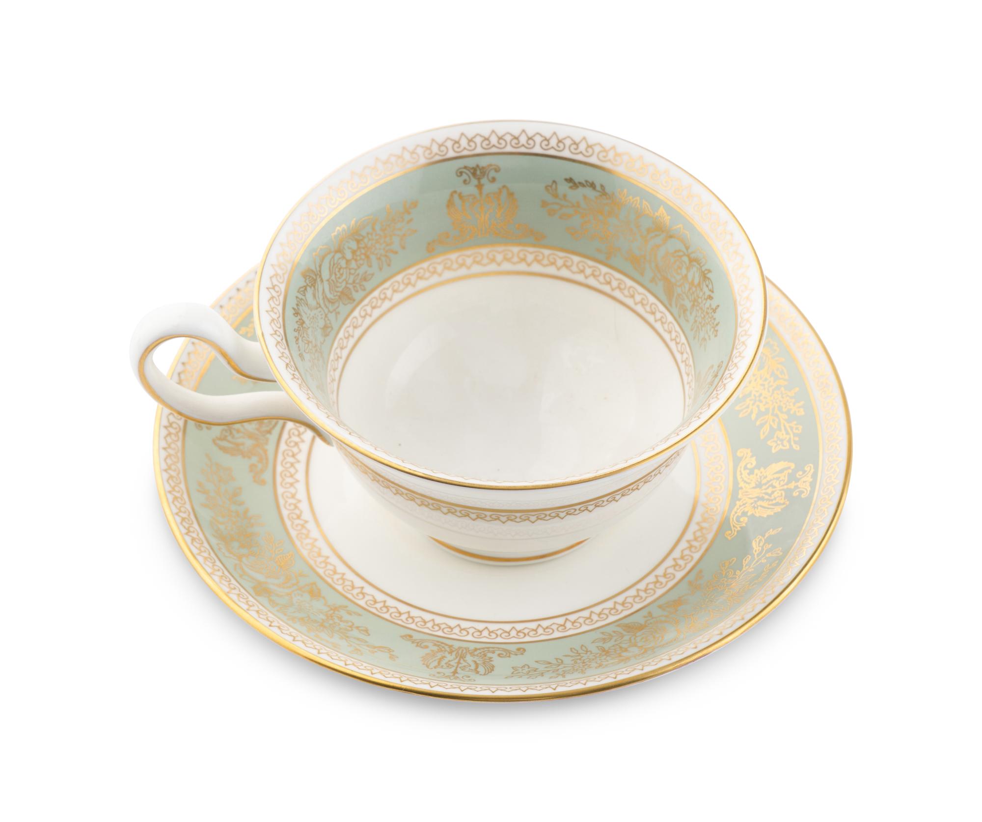 A Wedgwood Gold Columbia Porcelain Dinner Service