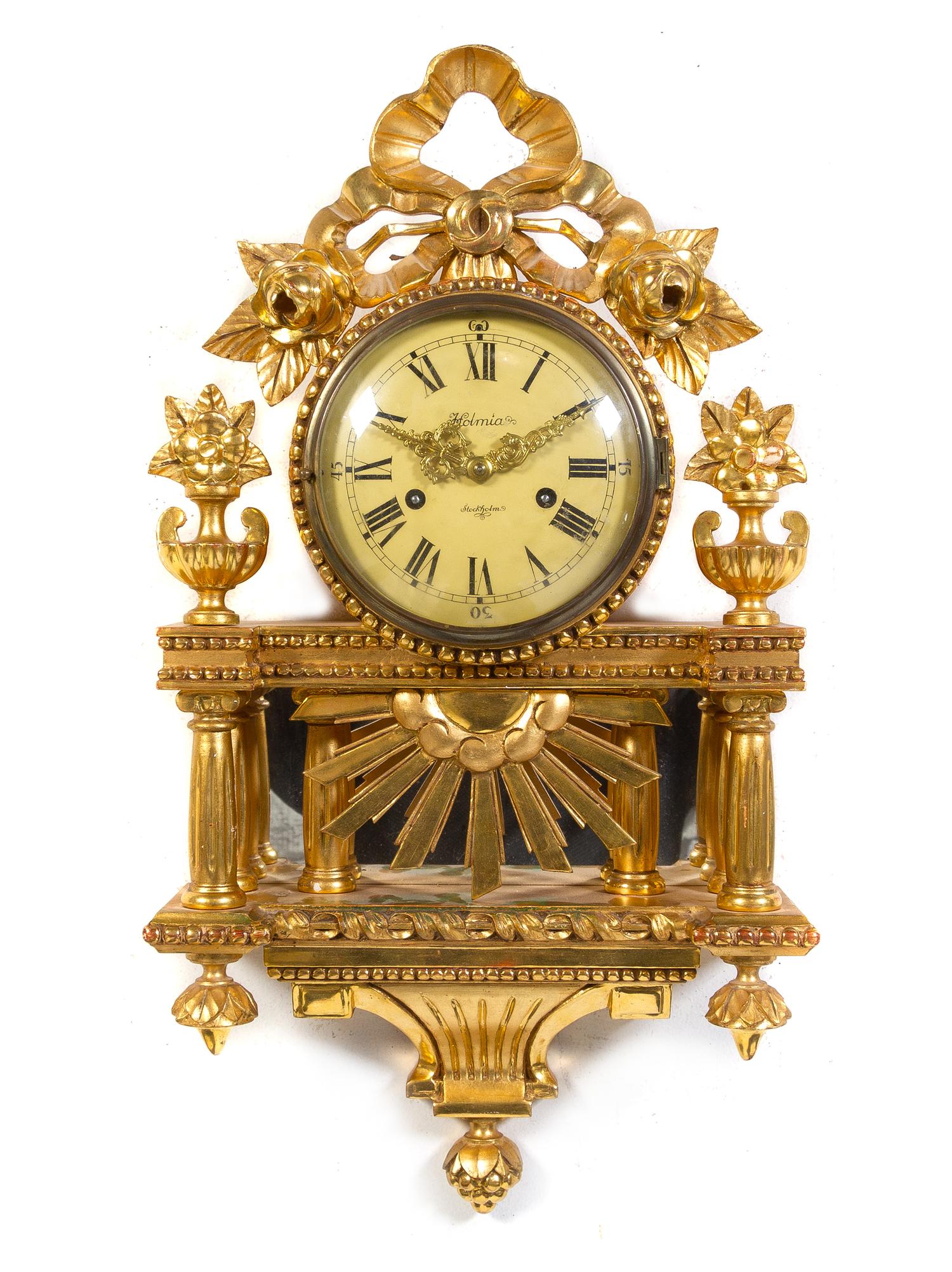 A Swedish Giltwood Cartel Clock Height 25 1/4 inches. — HOLMIA, EARLY 20TH CENTURY