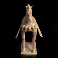 A Chinese painted and parcel-gilt pottery figure of a caparisoned horse 彩绘漆金陶马 Northern Wei dynasty ??