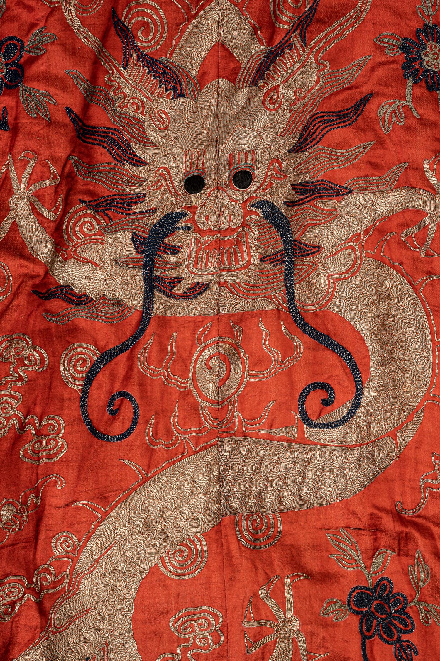 A Chinese Orange Ground Embroidered Silk Theatrical Dragon Robe