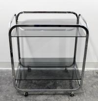 An Aluminum and Smoked Glass Bar Cart Height 27 3/4 x width 25 x depth 17 inches. — CIRCA 1970s