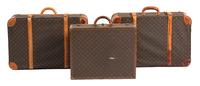 A Group of Three Louis Vuitton Suitcases Largest height 22 x width 30 x depth 10 inches. Hard case 16 x width 24 x depth 6 3/4 inches. — 20TH CENTURY