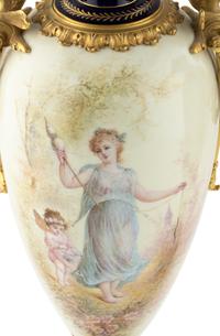 A Pair of Gilt Bronze Mounted Sèvres Style Porcelain Urns