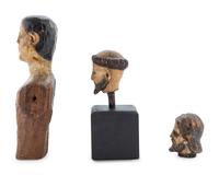 A Carved and Polychrome Painted Santos Heads
