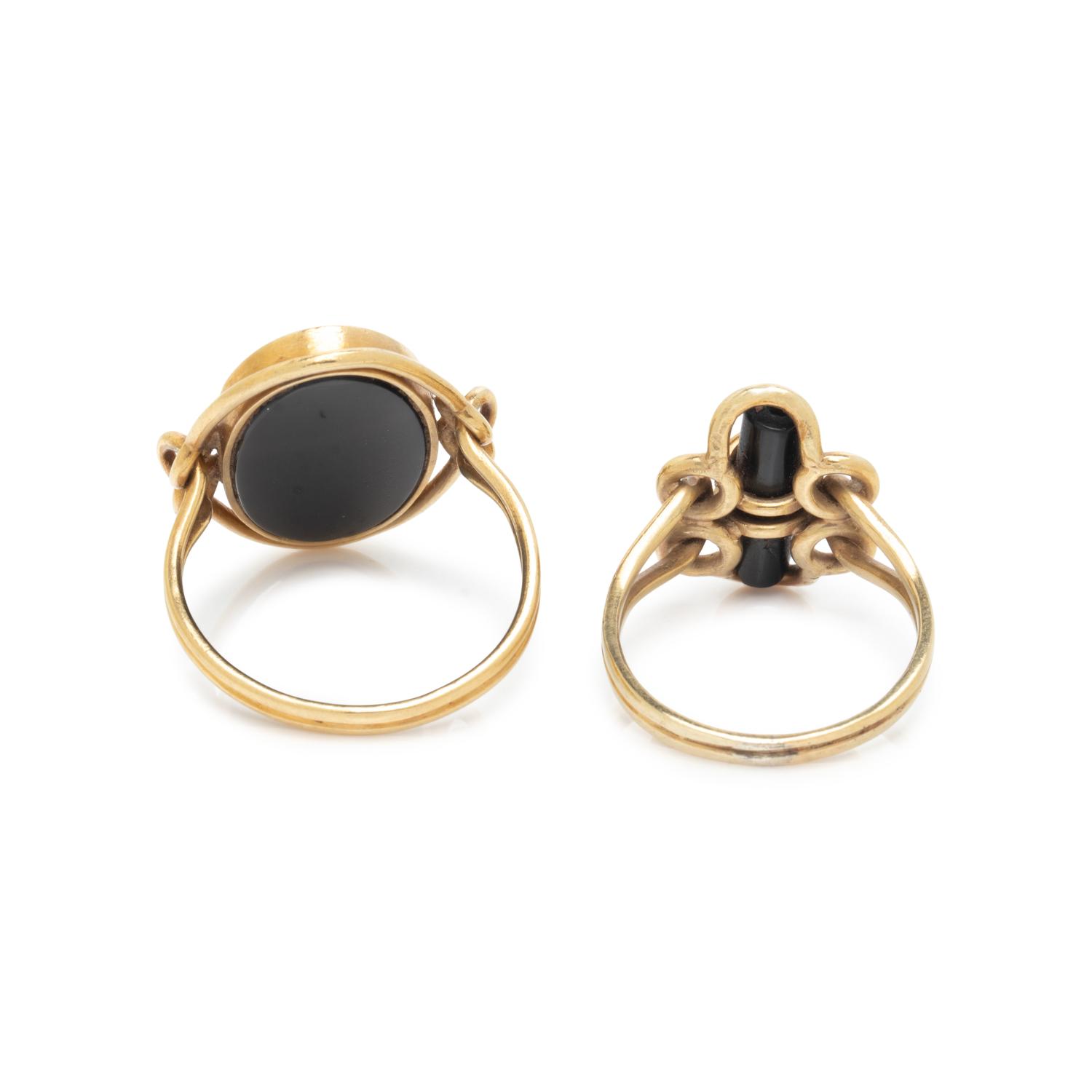 COLLECTION OF YELLOW GOLD AND BLACK ONYX RINGS