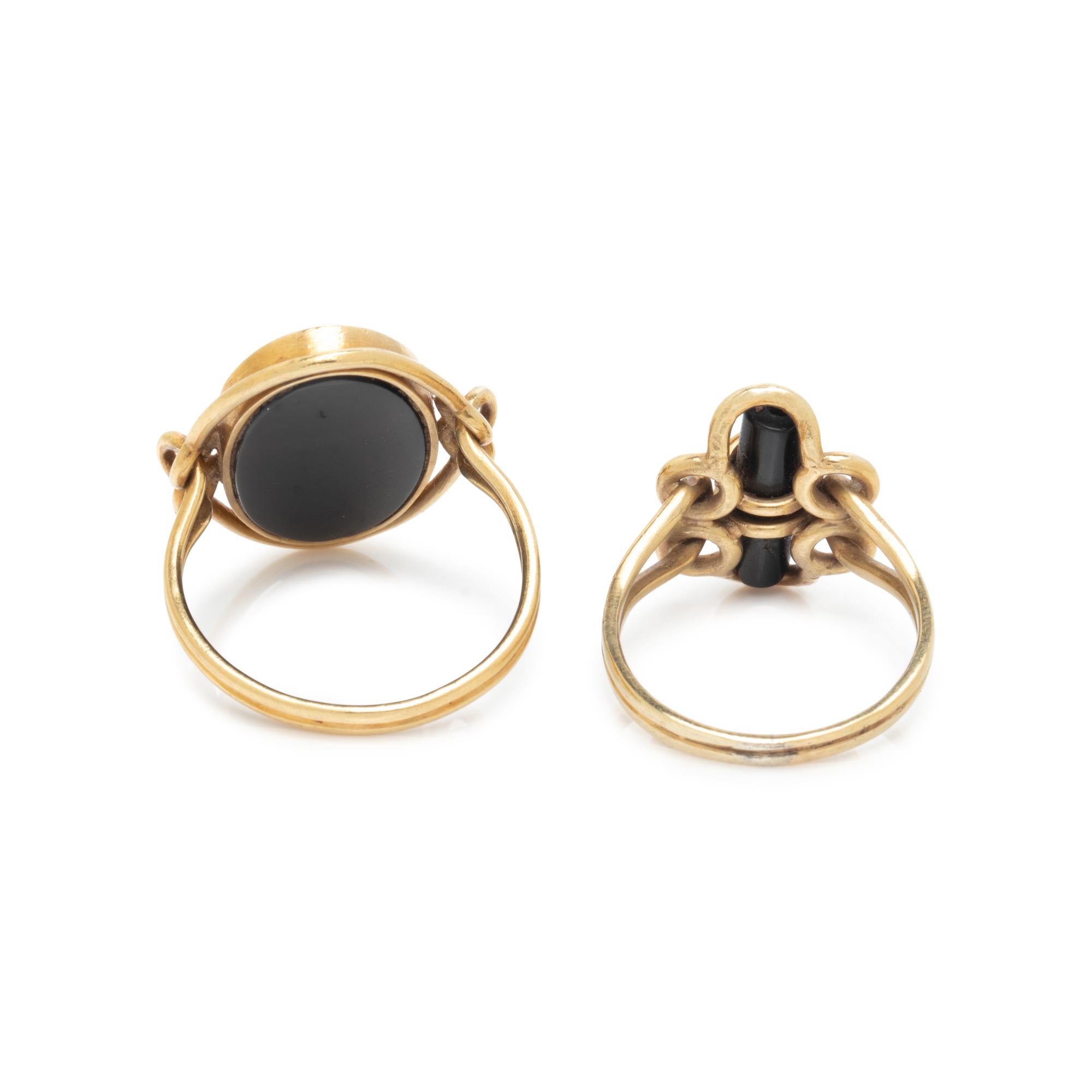 COLLECTION OF YELLOW GOLD AND BLACK ONYX RINGS